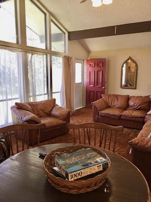 Groovy Pad living room, hang out on the rust sectional, and 70's era shag carpet