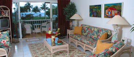 Living Room And Porch With View Of The Pool And Ocean  