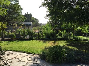 Side yard with entry into garden