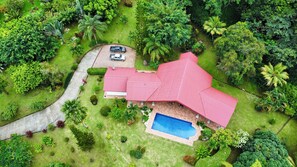 Arial view shows the property surrounded by the jungle