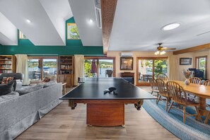 Main living area with dining room, living room and pool table