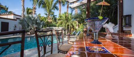 Heated Pool/ bar with rock waterfall feature