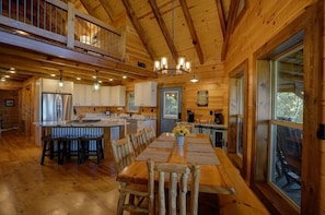 Open floor plan allows everyone to be part of the fun. Dinning table seats 8