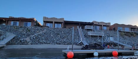 View of house, dock and beach from river 