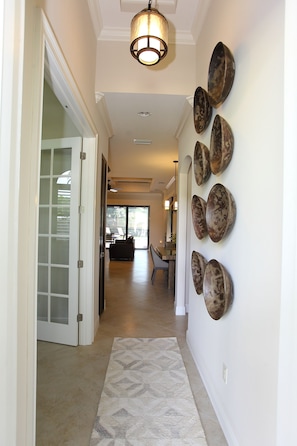 Front Foyer: Antique Bowls Adorning the Wall & a Wool Rug to Comfort Your Feet