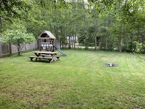 Yard with picnic table, play structure