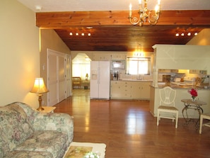 Large Elegant Living Room with Gold Chandeliers, Comfortable Sofas & Seating