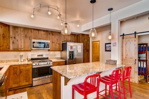 Well-equipped kitchen with stainless steel appliances 