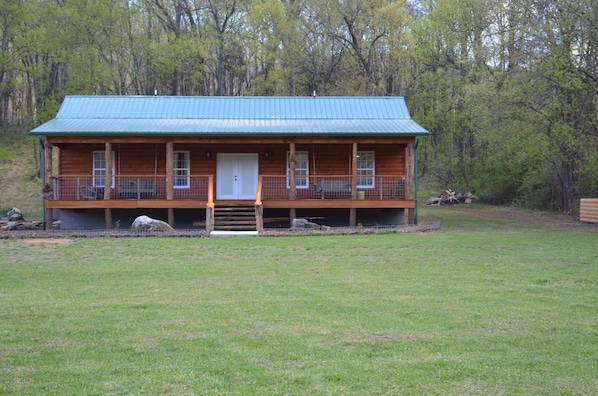 Front of cabin w/ 2 swings on front porch