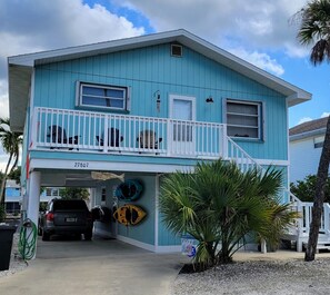 FRONT OF BUNGALOW BAY: plenty of parking under home and in front, deck seating