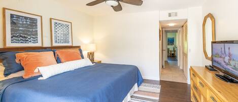 Master bedroom with private bathroom and hillside views. 