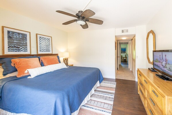 Master bedroom with private bathroom and hillside views. 