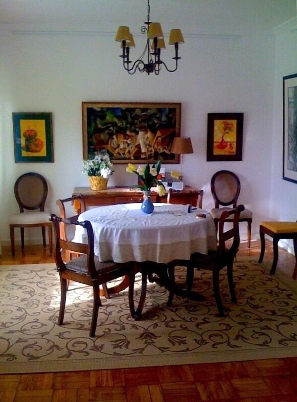 Dining room with art from the family.