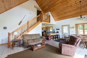 Open floor plan with living, dining, and kitchen.