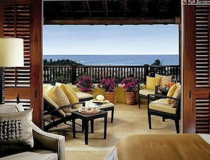 Expansive private terrace with comfortable chaises lounges