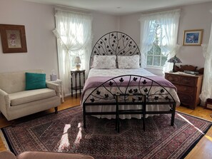 Another view of bed and small couch