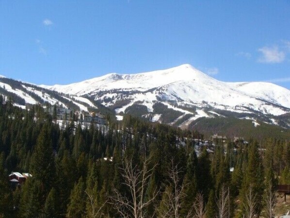 View of Breckenridge Ski Resort from private deck with hot tub