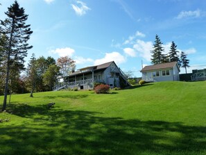 View of Kildare main cottage, and guest suite from the beach and dock area