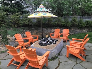 A favorite gathering spot: a propane- fueled monolithic stone fire pit