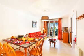 The living area is bright and cozy, perfect for relaxing after a wonderful day. (Note: this unit MAY feature a balcony or terrace).