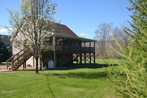 Spacious yard for corn hole and badminton.