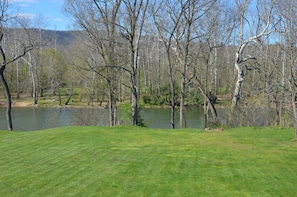 View of the yard and river from the deck