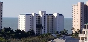 Aerial view of beachfront condo building Apollo in Marco Island