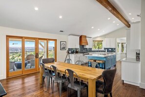 Large open concept kitchen with large kitchen island and plenty of counter space.   2 ovens, wolf range.