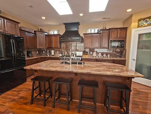 Large gourmet kitchen fully stocked.  High end cookware.