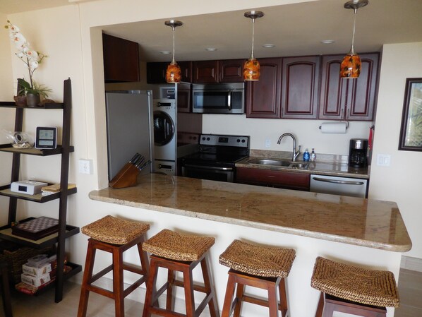 Granite Counters,  Stainless Appliances in make for an inviting kitchen