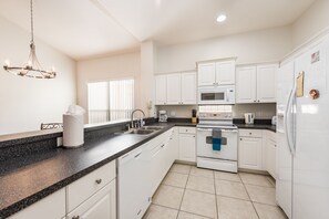 Gourmet kitchen, stocked with spices, cooking supplies, foil, ziploc bags, more!