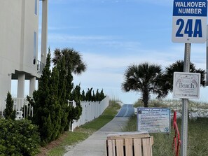 Covered walkway and boardwalk to the beach. 3 other entries nearby, as well.