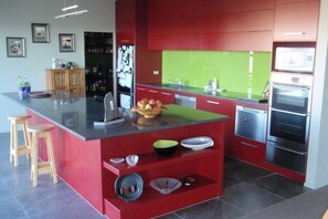 kitchen with twin dishwashers, double oven and scullery
