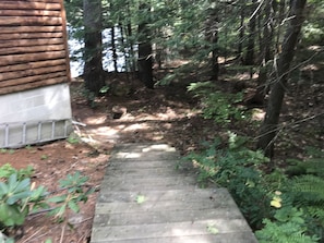 stairs to basement and lake access on right side of cabin