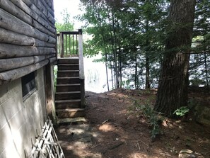 steps to lakefront deck from basement with lake access to the right of steps
