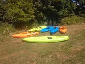 Fox Crossing kayaks on path to river