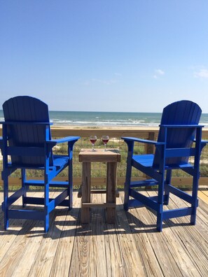 Sip on a refreshing drink while beach watching in oversized aderondak chairs.