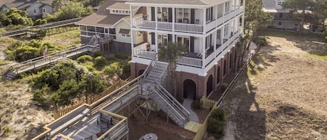 Aerial View of House and fenced in front yard