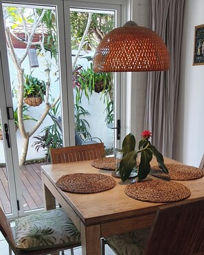 dining table , bifolds opening to north facing courtyard 