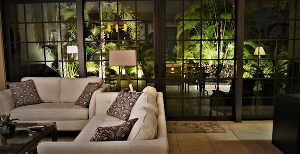 Living Room Looking at Patio Outside at Night