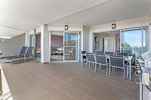 Enjoy a lazy afternoon or BBQ on the N-E facing balcony with expansive bay views