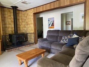 Large recliner lounge and cozy wood fire