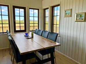 Bright and charming dining area with amazing nature views.