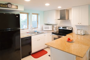 Full kitchen with many additional appliances 