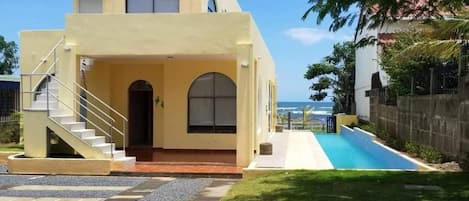 House and pool from entry gate.