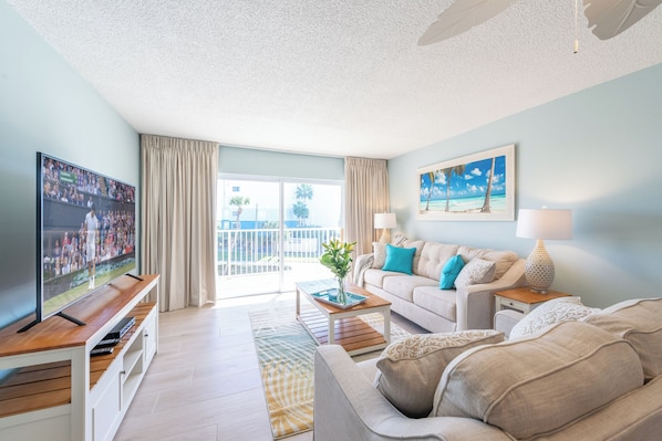 Cozy and inviting living area with stylish coastal decor and natural light