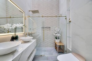 Master bathroom - second floor. Gorgeous double vanity, waterfall faucets with anti fog mirror, bidet, heated toilet seat, chandelier and bluetooth speaker.