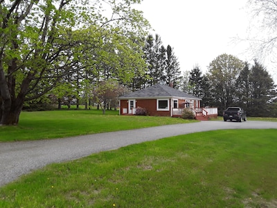 Cottage style home with a chef's kitchen, beautiful view and short walk to beach