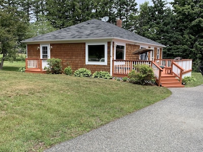 Cottage style home with a chef's kitchen, beautiful view and short walk to beach