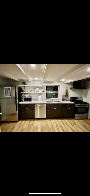 Newly remodeled fully stocked kitchen with access to deck overlooking the lake